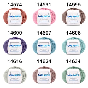 May include: Nine balls of yarn in different colors, including pink, purple, blue, green, and brown. Each ball has a label that says "Lana Gatto Made in Italy Super Soft" and a website address.
