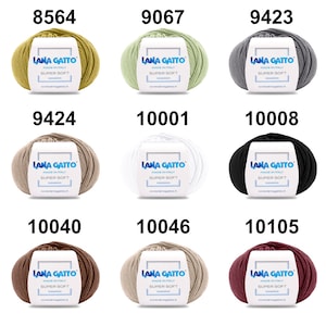 May include: Nine balls of yarn in different colors, including green, gray, beige, white, black, brown, and red. Each ball has a label that says "Lana Gatto" and "Super Soft".