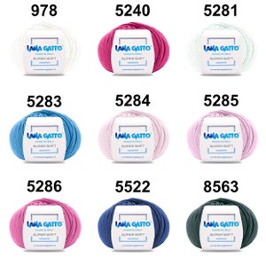 May include: Nine skeins of yarn in various colors, including white, pink, light blue, dark blue, and green. Each skein has a label that reads "Lana Gatto Made in Italy Super Soft" and a website address.