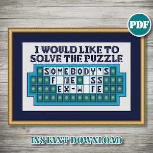 May include: Cross-stitch design framed in gold and navy blue, featuring the text "I WOULD LIKE TO SOLVE THE PUZZLE" above a puzzle board with the answer "SOMEBODY'S EX-WIFE". The words "INSTANT DOWNLOAD" are at the bottom.
