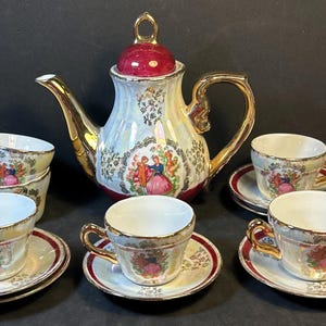 Antique Imperial Japan Design Fine Porcelain 22k  Gold Trim Tea Set 14 pieces Pitcher and 6 cups and Saucers Great condition!