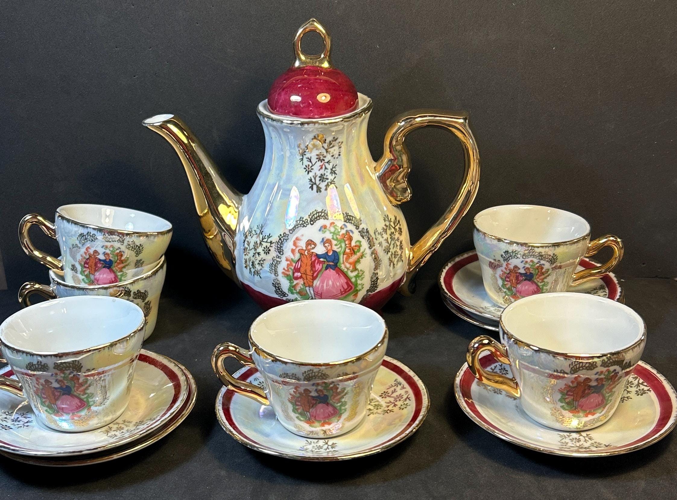 Antique Imperial Japan Design Fine Porcelain 22k  Gold Trim Tea Set 14 pieces Pitcher and 6 cups and Saucers Great condition!