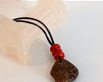Pendant of genuine amber with genuine coral