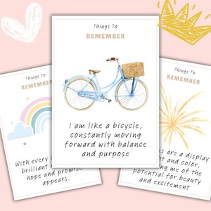 May include: Three cards with inspirational quotes on a pink background. The central card features a light blue bicycle with a basket. Text on the cards includes "Things to Remember" and motivational phrases about balance, hope, and beauty.