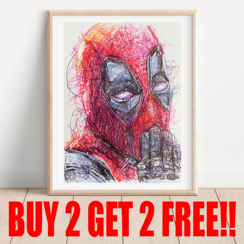 May include: Framed artwork featuring a vibrant, scribbled portrait of Deadpool. The character's mask is red with black eye shapes, and the artwork is framed in a light wood. The text "BUY 2 GET 2 FREE!!" is displayed in red at the bottom.