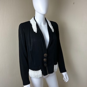 A 1935 Elsa Schiaparelli Couture Black Wool Beaded Evening Jacket