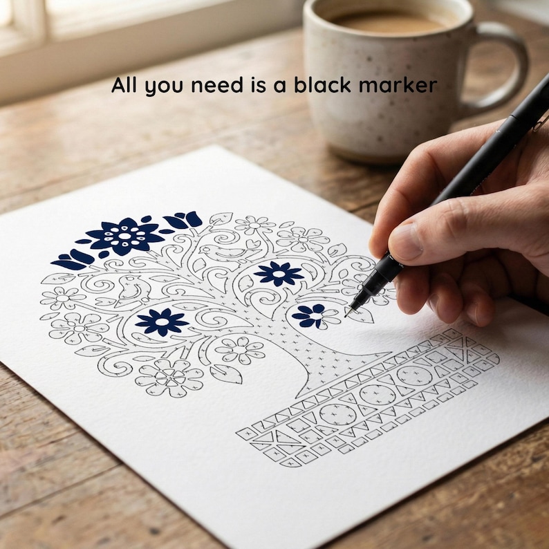 May include: A black marker is used to colour a tree design on white paper. The tree has a floral pattern with dark blue accents. The text "All you need is a black marker" is above the paper. A mug of coffee sits in the background.