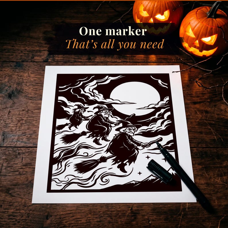 May include: A white rectangular paper featuring a black ink illustration of three witches flying on broomsticks against a large full moon and cloudy night sky. A black felt-tip marker with its cap removed lies on the paper. Text reads: One marker That's all you need.