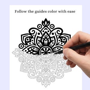 May include: A black and white mandala coloring page with the text "Follow the guides color with ease" at the top. The image is partially colored with a black pen.