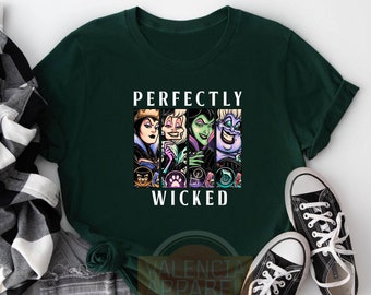 May include: Forest green t-shirt featuring a graphic of Disney villains with the text "PERFECTLY WICKED". The graphic includes images of the Evil Queen, Cruella de Vil, Maleficent, and Ursula. Black and white sneakers are visible.