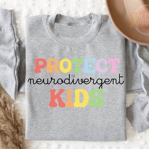 a gray shirt with the words project neuroavement kids on it