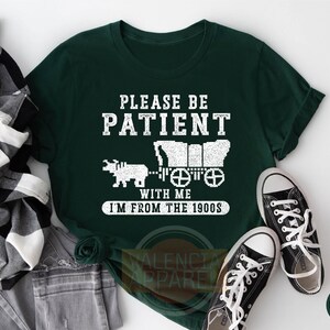 a t - shirt that says please be patient with me i'm from the