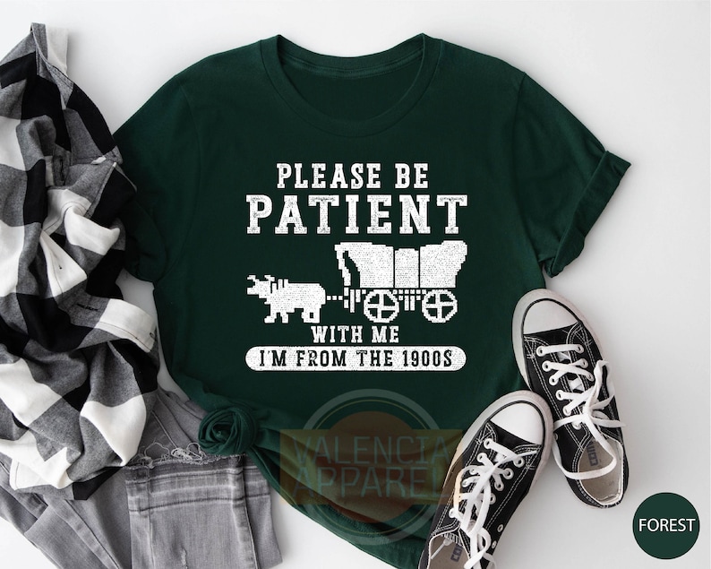 a t - shirt that says please be patient with me i'm from the