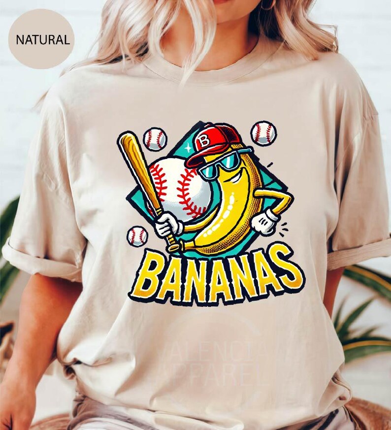 a woman wearing a t - shirt with a baseball bat and banana on it