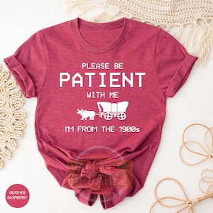 a t - shirt that says please be patient with me i'm from the