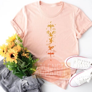 a t - shirt with a flower and a pair of jeans