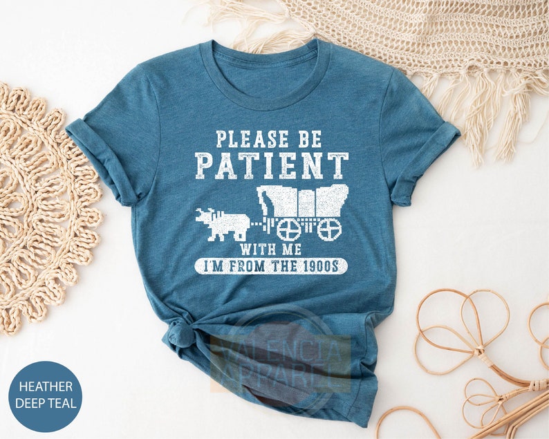 a t - shirt that says please be patient with me i'm from the