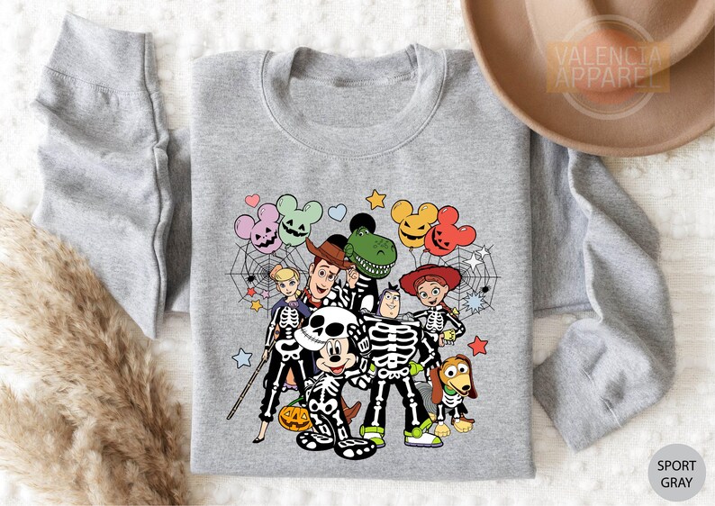 a couple of cartoon characters on a gray shirt