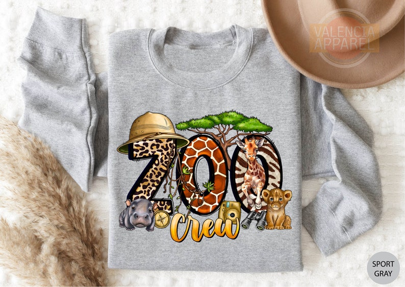 a gray shirt with a picture of zoo animals on it