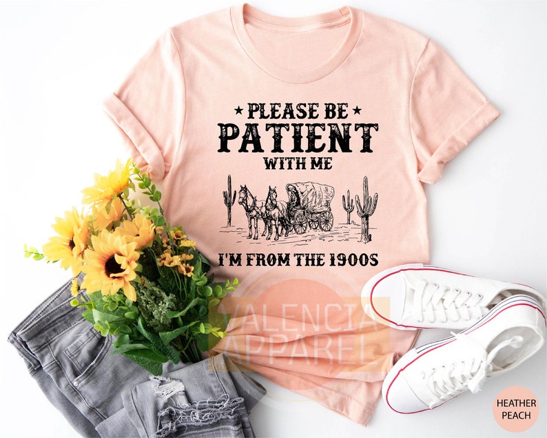 a t - shirt that says please be patient with me i'm from the