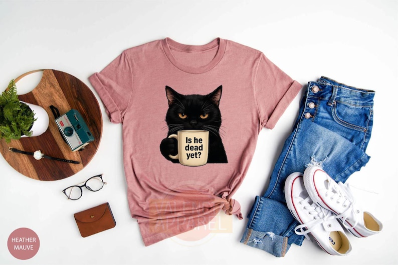 a t - shirt with a black cat holding a cup of coffee