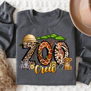 a gray shirt with a picture of animals and the words zoo crew on it