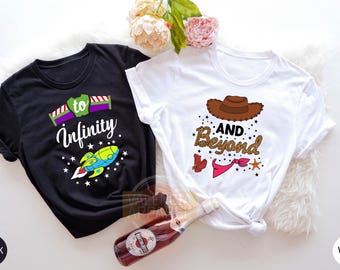 May include: Two t-shirts, one black and one white, with a Toy Story theme. The black shirt has a rocket ship and the text "to infinity". The white shirt has a cowboy hat and the text "and beyond".
