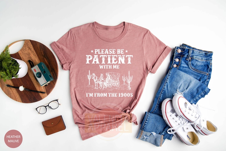 a t - shirt that says please be patient with me i'm from the