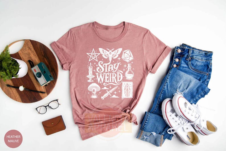 a t - shirt that says stay weird on it