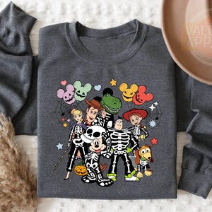 a gray shirt with a skeleton and mickey mouse on it
