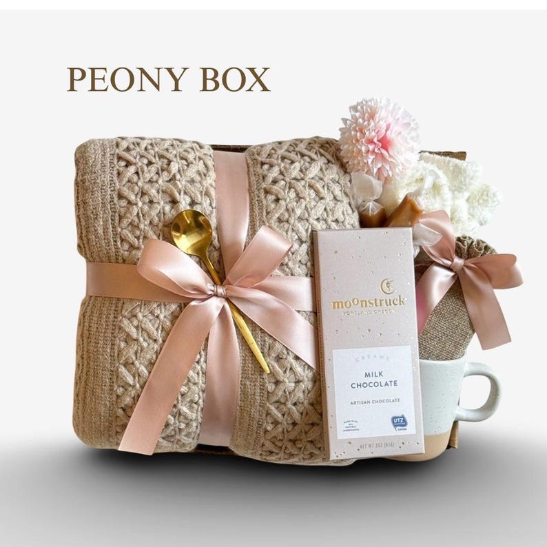 May include: A set of three ceramic mugs with a speckled, matte finish in cream, light grey, and dark grey. Each mug has a simple, minimalist design and a rounded handle.