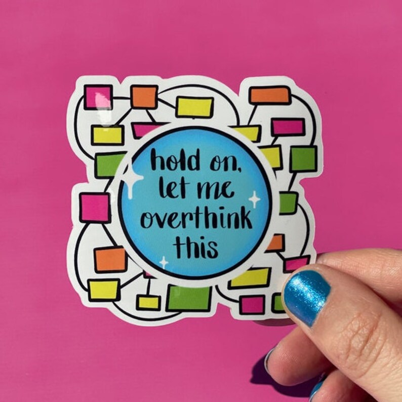 May include: A white sticker with a blue circle in the center. The circle has the text "hold on, let me overthink this" in black. The sticker also has a colorful diagram of connected boxes.