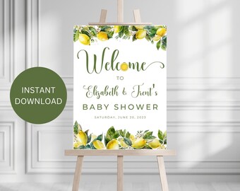 May include: A white welcome sign with a lemon theme. The sign says "Welcome to Elizabeth & Trent's Baby Shower" and the date "Saturday, June 20, 2023".