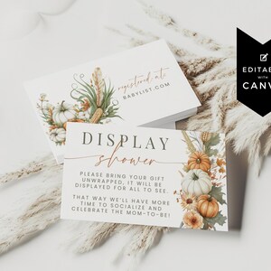 May include: Two white rectangular cards featuring watercolor illustrations of pumpkins, wheat, and autumn leaves. The top card reads registered at babylist.com. The bottom card reads DISPLAY shower, please bring your gift unwrapped, it will be displayed for all to see. That way we'll have more time to socialize and celebrate the mom-to-be!