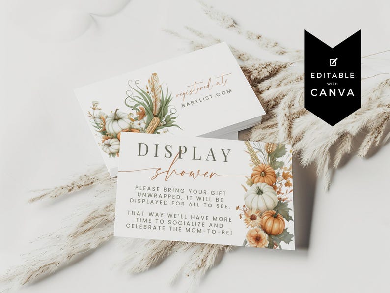 May include: Two white rectangular cards featuring watercolor illustrations of pumpkins, wheat, and autumn leaves. The top card reads registered at babylist.com. The bottom card reads DISPLAY shower, please bring your gift unwrapped, it will be displayed for all to see. That way we'll have more time to socialize and celebrate the mom-to-be!