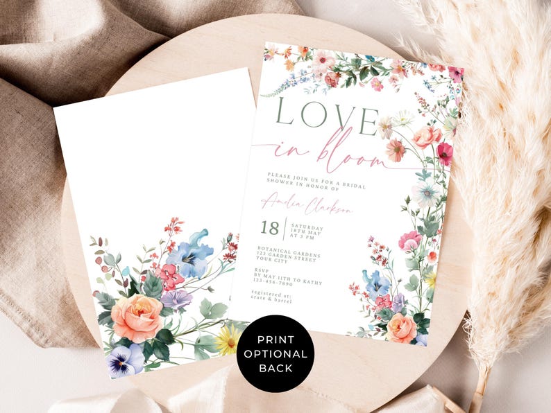 May include: A bridal shower invitation with floral watercolor design. The invitation features the words "Love in Bloom" and event details. The design includes pink, blue, and yellow flowers. A matching blank card is also included.