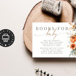 May include: A rectangular card featuring the text BOOKS FOR baby and a poem requesting books instead of cards. The design includes watercolor illustrations of orange and white pumpkins, sunflowers, and dried foliage on the right side.