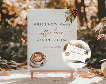 May include: A white sign on a wooden easel with the text "GUESS HOW MANY coffee beans ARE IN THE JAR". A watercolor image of a coffee cup and beans decorates the sign. A smaller card with the same design is also visible.