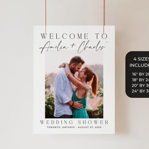 May include: A wedding shower sign with the text "WELCOME TO Amelia + Charles" above a photo of a couple embracing. The sign includes the text "WEDDING SHOWER" and the date and location. Four size options are listed.