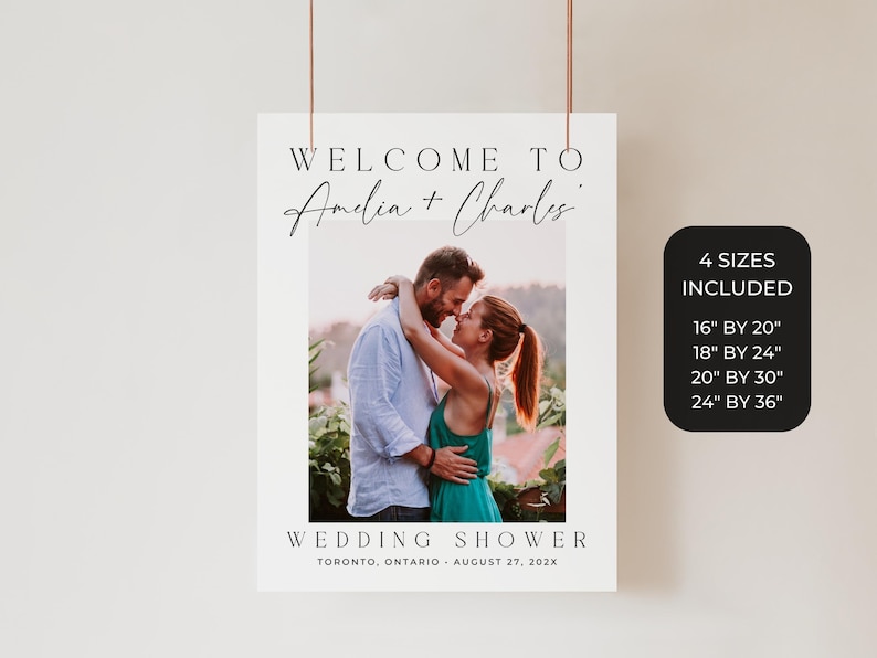 May include: A wedding shower sign with the text "WELCOME TO Amelia + Charles" above a photo of a couple embracing. The sign includes the text "WEDDING SHOWER" and the date and location. Four size options are listed.