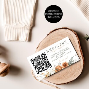 May include: A rectangular registry information card featuring a black QR code on the left and text reading "REGISTRY INFORMATION MICHELLE AND BABY GREY ARE REGISTERED AT TARGET. KINDLY SCAN TO VIEW. Thank you!" with watercolor pumpkin illustrations.