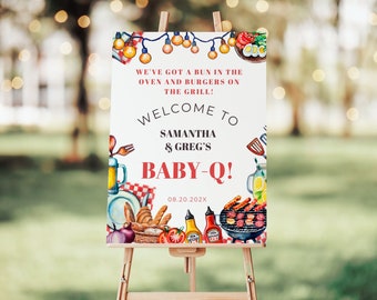 May include: A white welcome sign with red and blue text that reads "We've got a bun in the oven and burgers on the grill! Welcome to Samantha & Greg's Baby-Q! 08.20.202X". The sign is decorated with watercolour illustrations of food and grilling items, including a grill, hot dogs, buns, ketchup, and a pitcher of lemonade.