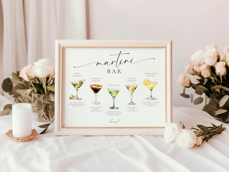 May include: A white sign with a black frame and the text "martini bar" in a cursive font. The sign lists five different types of martinis with illustrations of each drink.