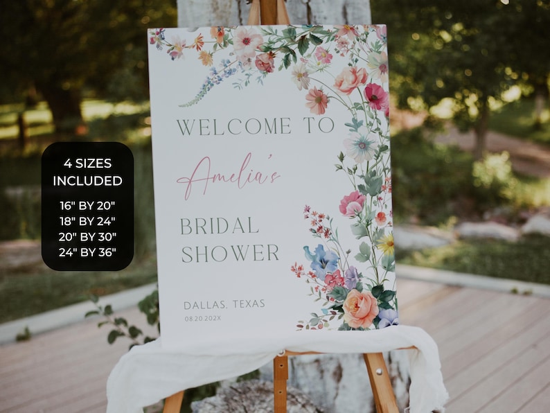 May include: A white sign with floral accents, announcing a bridal shower. The sign reads "Welcome to Amelia's Bridal Shower" with the location and date. Four size options are listed: 16" by 20", 18" by 24", 20" by 30", and 24" by 36".