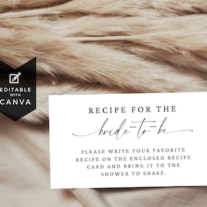 May include: White card with black text that reads "Recipe for the bride-to-be".  The text continues, "Please write your favorite recipe on the enclosed recipe card and bring it to the shower to share."