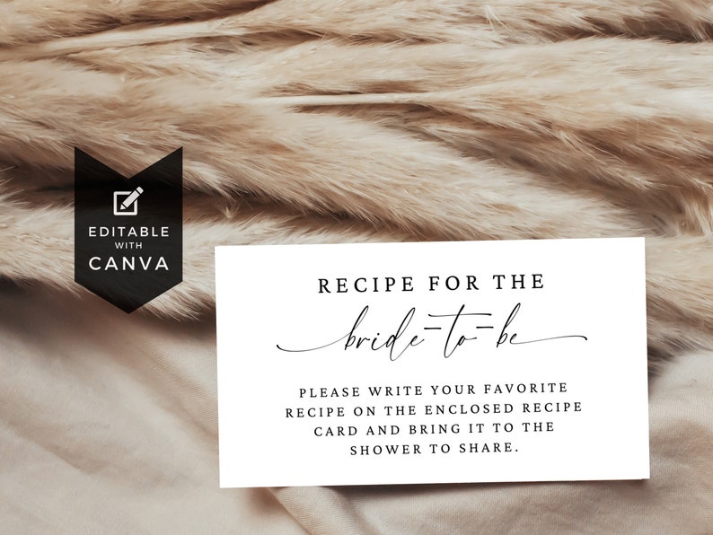 May include: White card with black text that reads "Recipe for the bride-to-be".  The text continues, "Please write your favorite recipe on the enclosed recipe card and bring it to the shower to share."