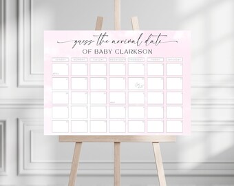 Könnte beinhalten: Ein rosa-weißes Kalenderschild auf einer Staffelei mit dem Text "guess the arrival date of BABY CLARKSON" in eleganter Schrift. Das Kalendarium ist für April und Mai, mit einem Datum "One Date!"