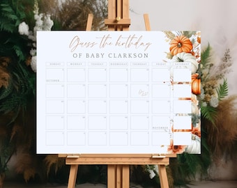 Op de afbeelding: Een rechthoekig bord met de titel Guess the birthday OF BABY CLARKSON met een kalenderrooster voor oktober en november. Het ontwerp bevat aquarelillustraties van oranje en witte pompoenen en gedroogd loof aan de rechterkant.