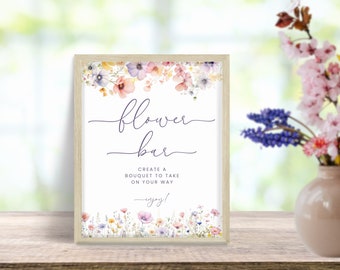 Può includere: Un cartello con un bordo floreale recita "flower bar" e "create a bouquet to take on your way - enjoy!"