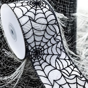 WR 63-5113  2.5” x 10 yard  Halloween Black Spider Web on White Satin wired edge ribbon